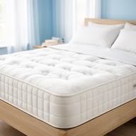 Pocket sprung mattress with white quilted cover in a bright bedroom